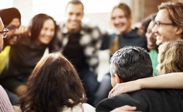 Caregivers Support Group holding shoulders