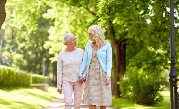 Women on a walk with her Aging Parents