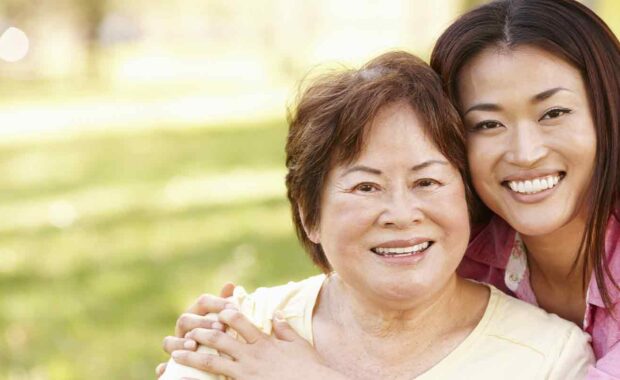smiling while women is Caring For Aging Parents