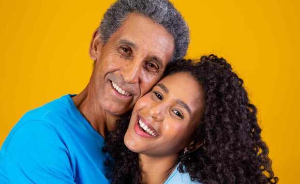 girl smiling with her dad while she is Caring For The Elderly