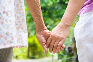 senior holding hand while using a senior transportation in virginia