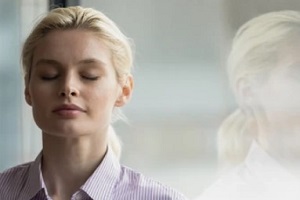 girl taking deep breath after feeling relaxed