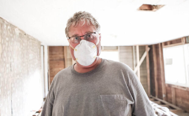 construction worker wearing safety mask during demo