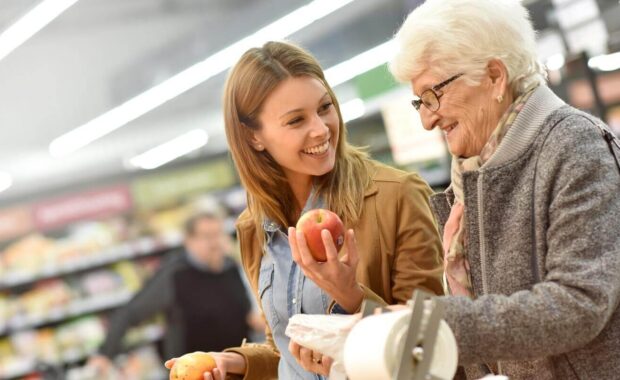 elderly woman with young woman at the grocery store