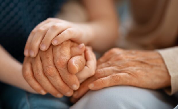 granddaughter supporting her grandmother
