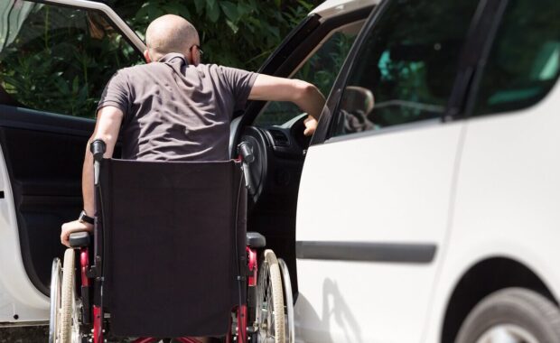 adult driver in wheelchair getting into the car