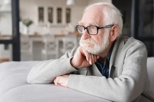 Fairfax, VA old man sitting in sofa