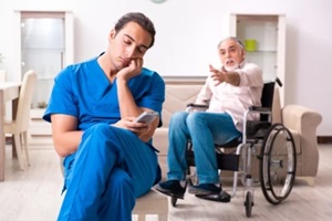 caregiver sleeping while old man calling for help