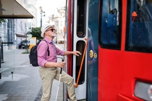 old man taking public transport