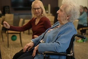 a lively atmosphere fills the community center as seniors participate in group activities