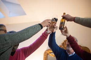 Seniors Toasting Their Glasses at Meeting