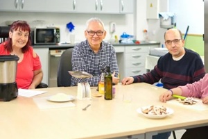 diverse group of people cooking together promoting inclusion