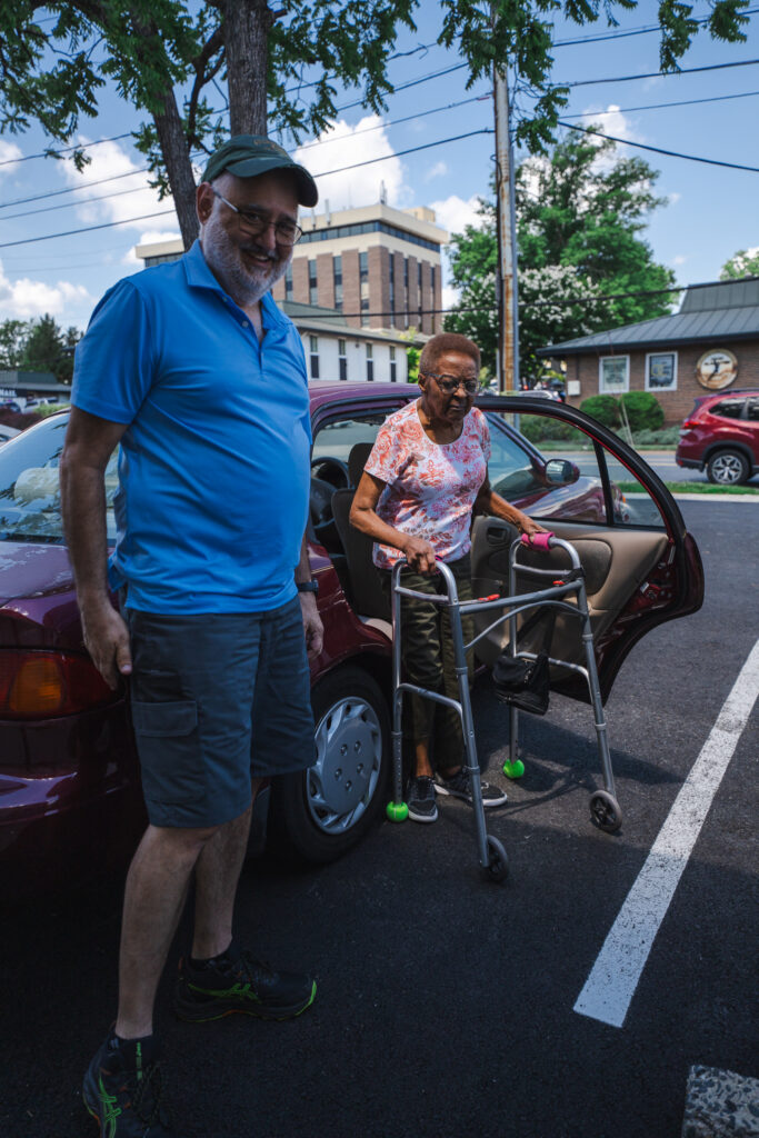 wolf scherer a volunteer for scnova with lalita, who he has been driving for several years