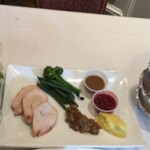 Salad, pork, greens and sides